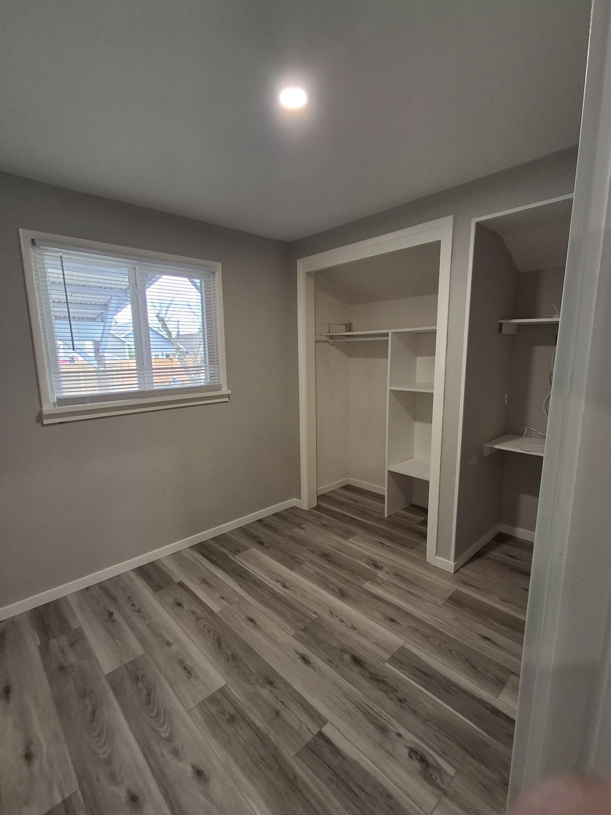 JCR Construction — bedroom with built-in closet shelving, Everett WA